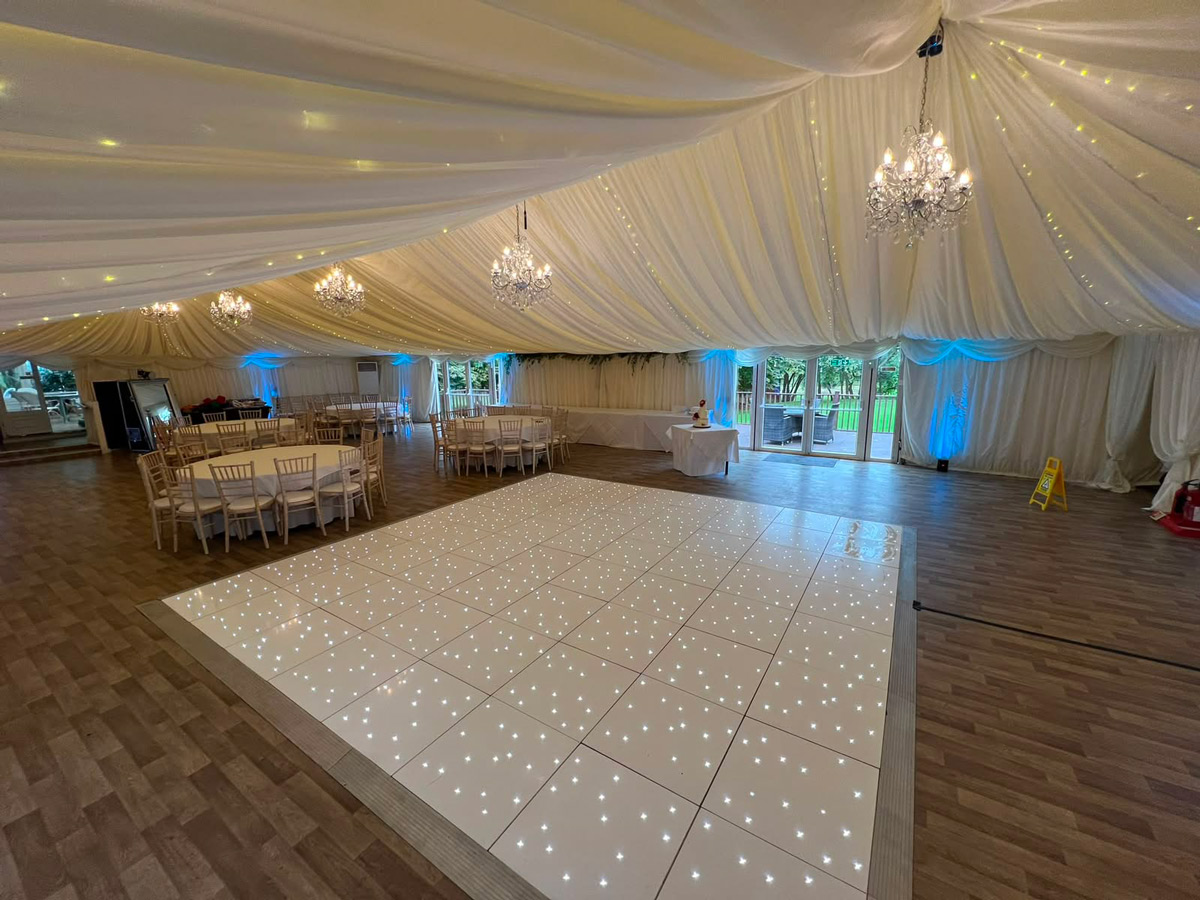 White starlit dance floor hire in a marquee wedding venue in Essex